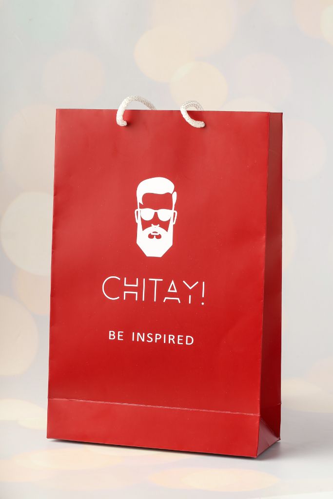 CHITAY! Be Inspired bag — red coated board, white rope handle, white logo + mascot