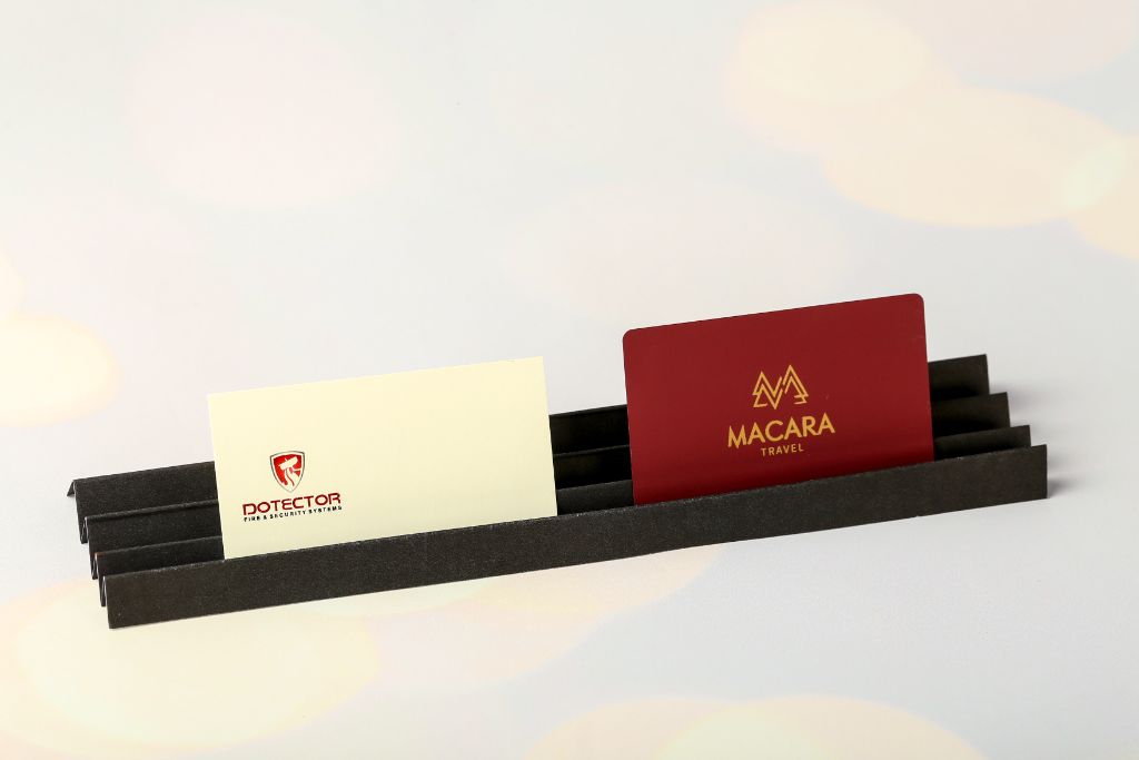 Dotector and Macara Travel business cards in a holder