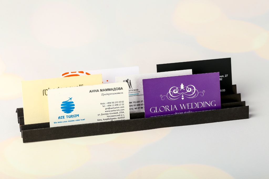 Multiple business cards fanned out in a holder
