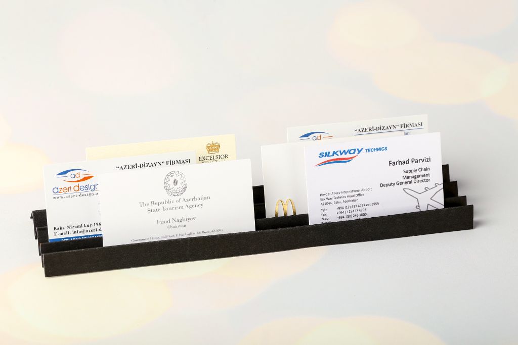 Silkway Technics business cards in a metal holder