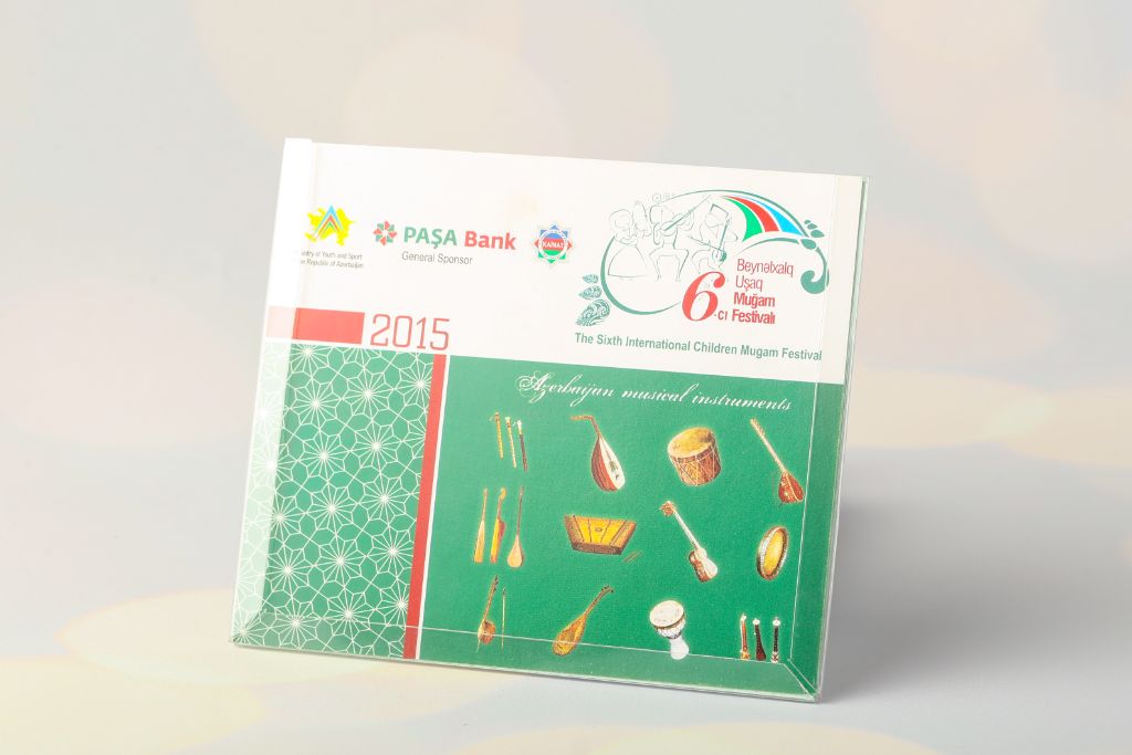 Desk calendar 2015 — 6th International Children’s Mugham Festival, PAŞA Bank General Sponsor, cover with Azerbaijani musical instruments