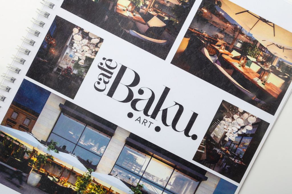 Cafe Baku Art — spiral-bound photo catalogue, interior collage spread