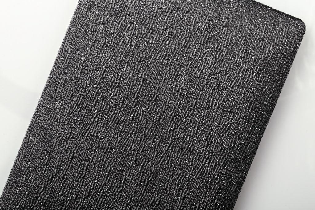 Black textured folder — cover close-up