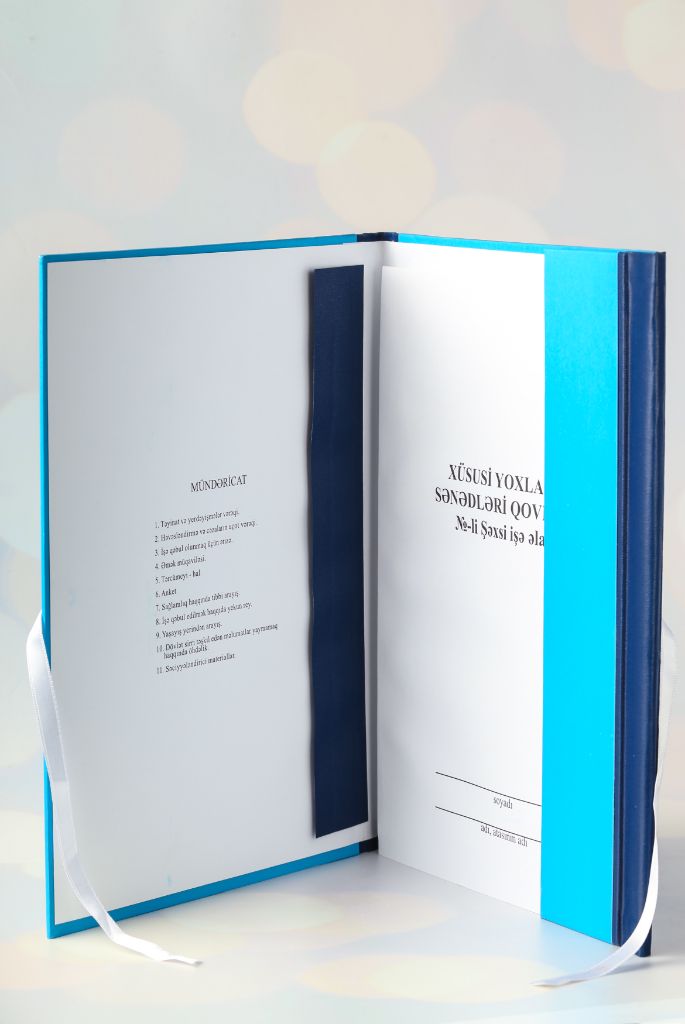 Blue hardcover folder — open, table of contents