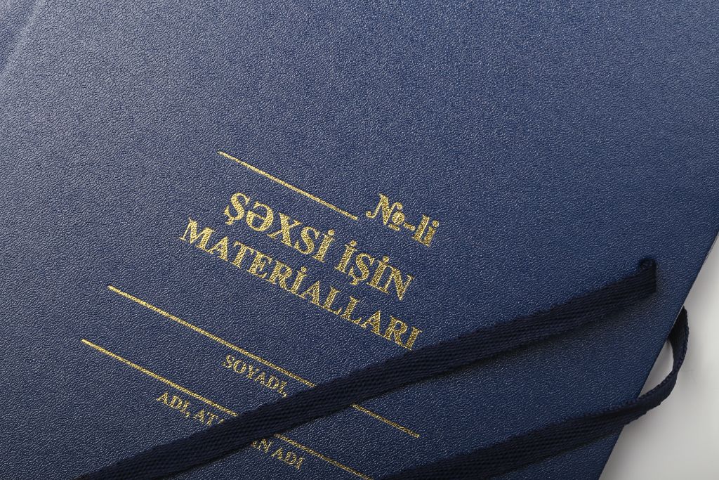 Blue folder — gold letters close-up