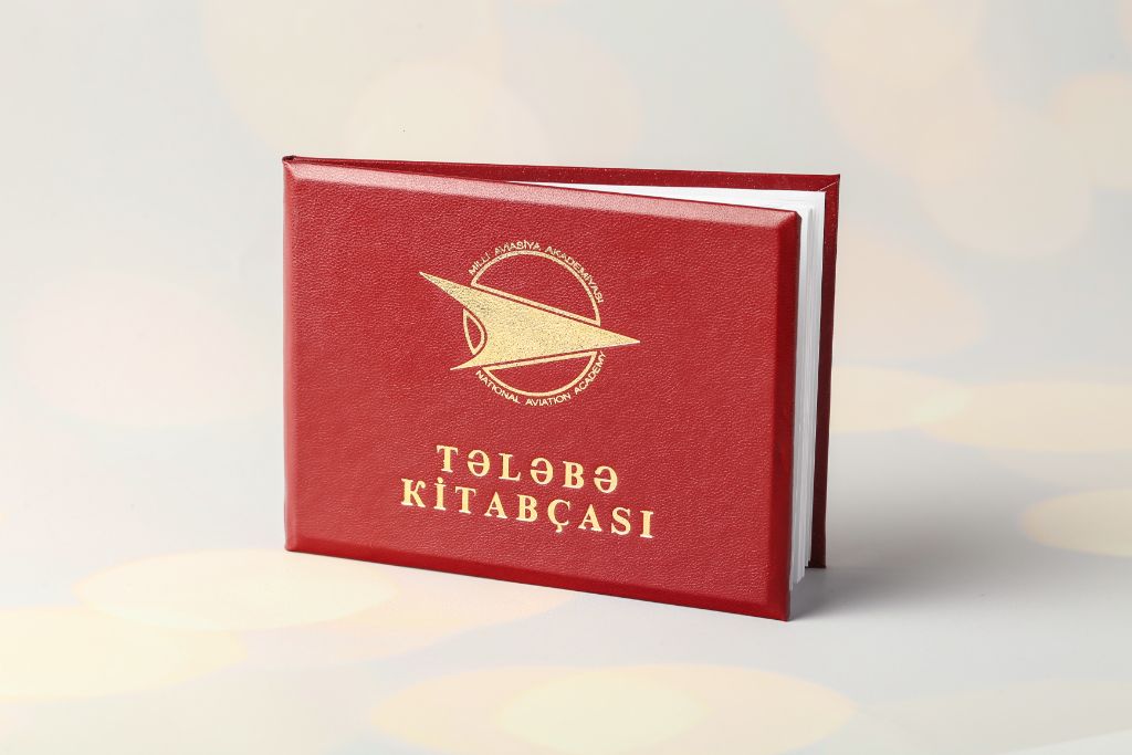 Student booklet of the National Aviation Academy — cover, red leather, gold embossing, academy logo