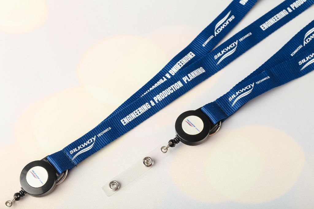 Silkway Technics Engineering & Production Planning lanyard — navy jacquard, retractor yo-yo with logo, snap-hook attachment
