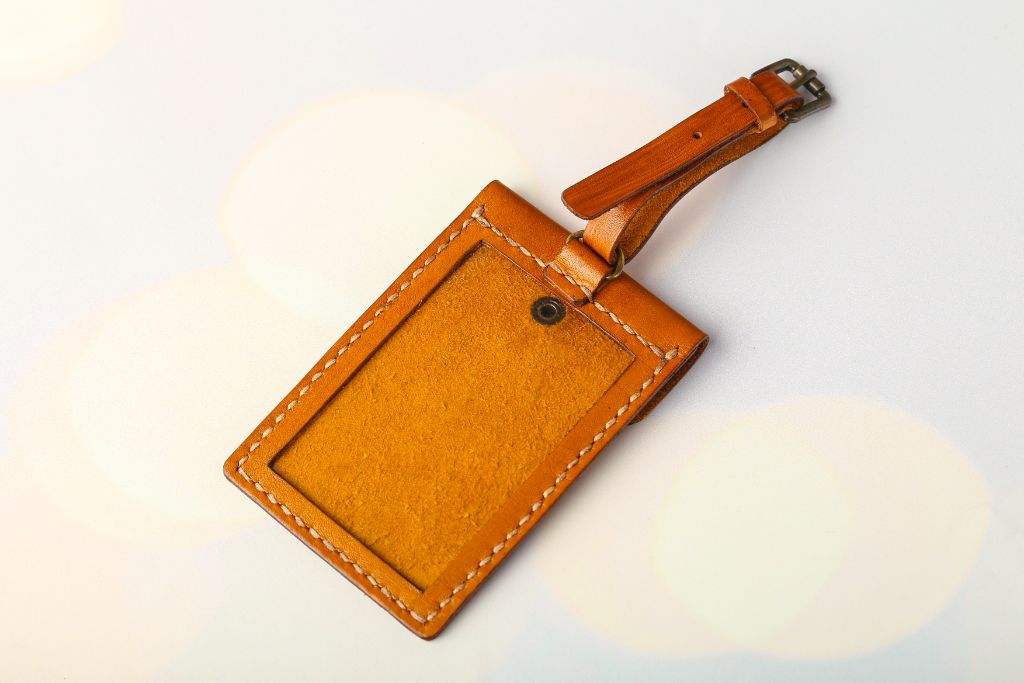 Leather luggage tag — tan natural leather, hand stitching, strap
