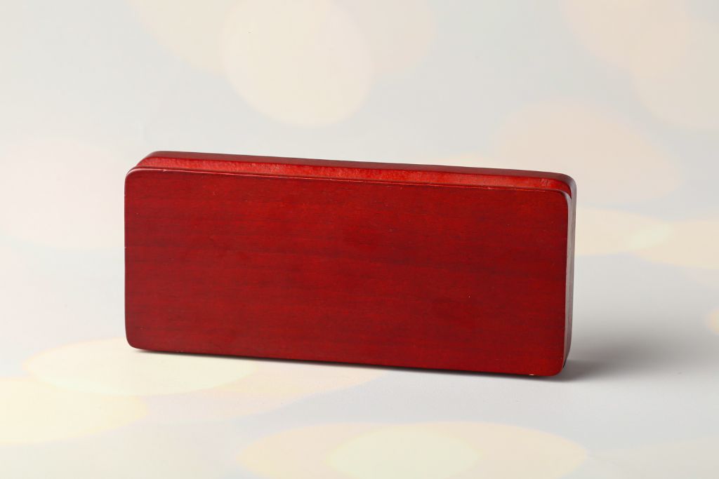 Wooden pen box — dark red wood, standing vertically, side view