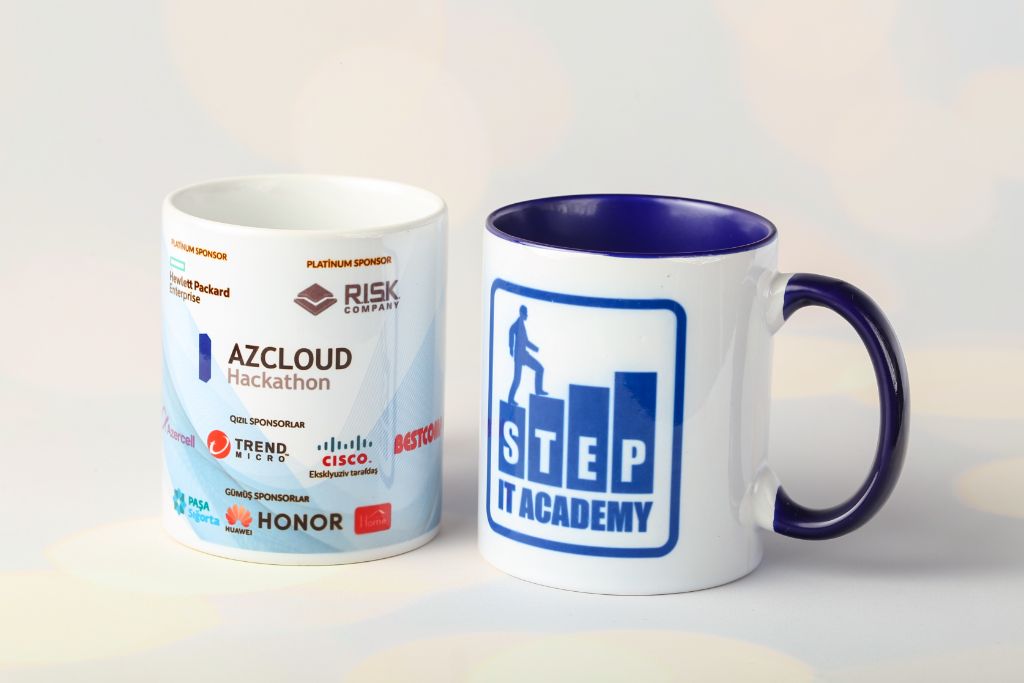 Branded mugs AzCloud Hackathon — sponsors Risk Company, Cisco, Bestcomp Group, Honor, Pasha Sigorta — back and front view