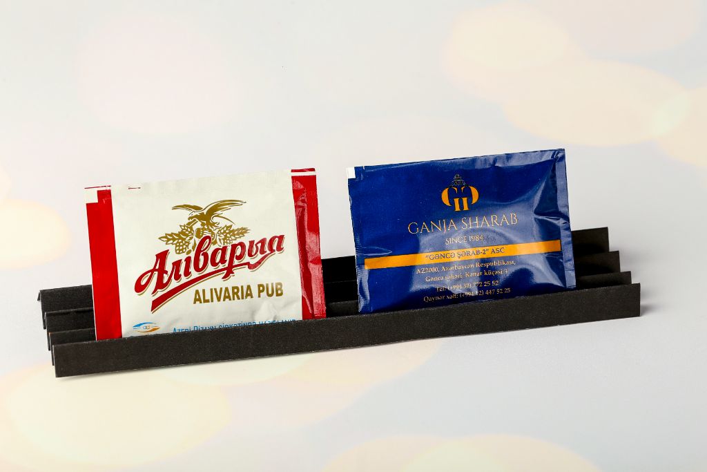 Branded napkins Alivaria Pub and Ganja Sharab — full-colour print on packaging, black holder