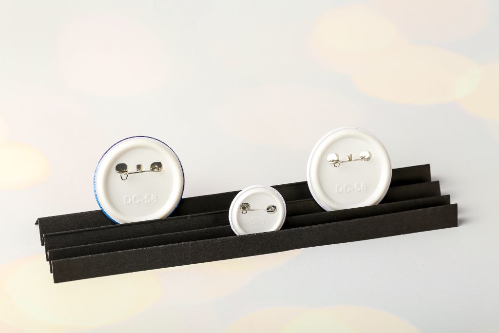 Button pins — reverse side, three sizes DC-58, DC-37, DC-58, metal pin-back clasp