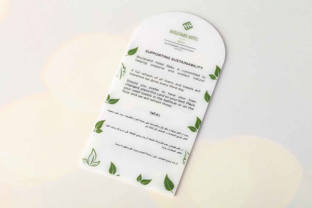 Information card for Boulevard Hotel Baku — Supporting Sustainability — EN/AR, arch shape, white acrylic