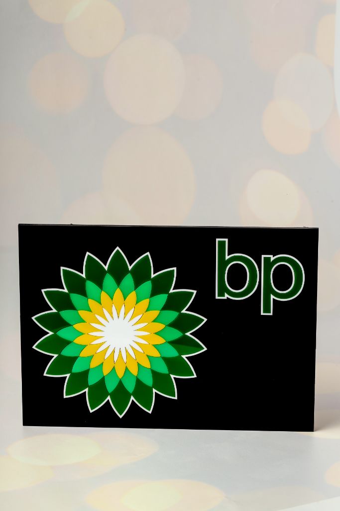 BP corporate fascia — black acrylic, multi-layer BP logo, front view