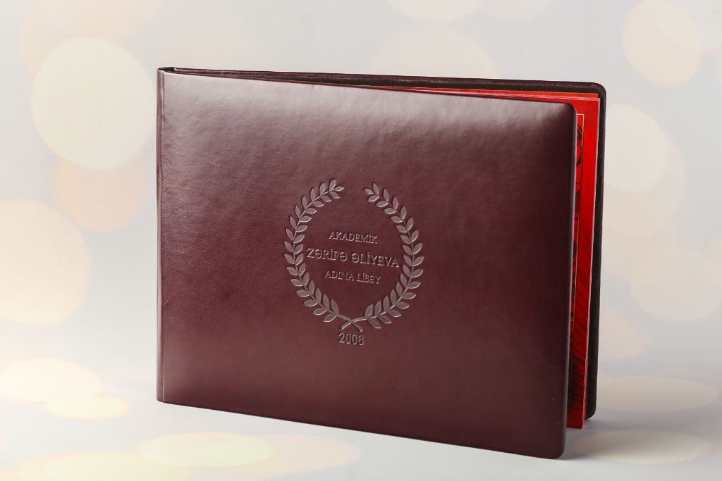 Academic vignette Akademik Zərifə Əliyeva — leather landscape cover, blind embossing of crest and inscription 2008