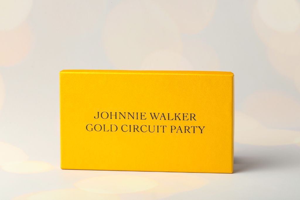 Johnnie Walker Gold Circuit Party — yellow gift box, logo embossing